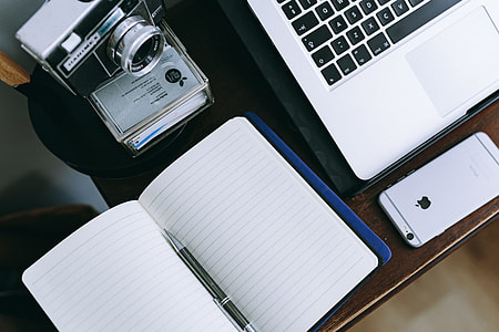 Elegant workspace with Macbook, iPhone, business cards and notebooks thumbnail