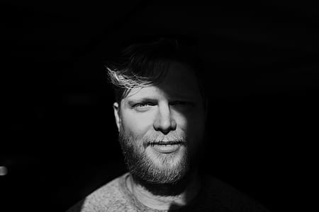 grayscale photo of man wearing crew-neck shirt thumbnail
