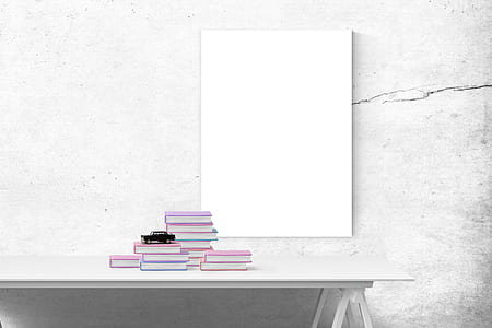 assorted books on white table thumbnail
