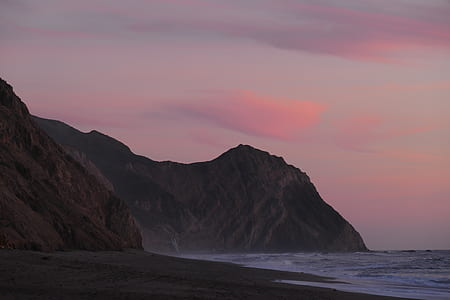 mountain beside ocean thumbnail