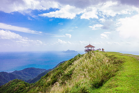 brown gazebo on top of the mountain under cloudy sky thumbnail