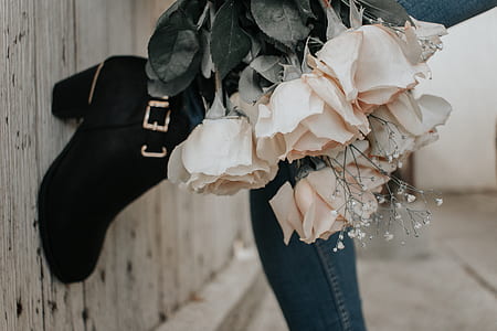 person holding bouquet of flowers thumbnail