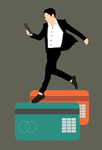 Man on mobile phone walking on credit cards. Mobile online commerce. thumbnail