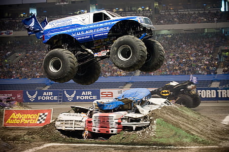 blue monster truck doing stunt at daytime thumbnail