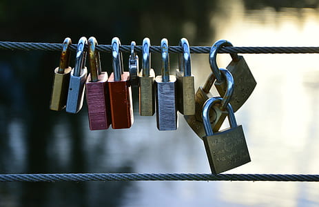padlocks on steel cable during daytime thumbnail