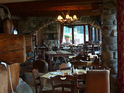 brown wooden table and chairs inside room thumbnail