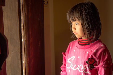 girl standing near door thumbnail