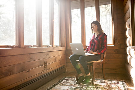 MacBook on person lap near window thumbnail