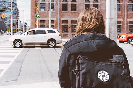 woman standing beside pedestrian lane thumbnail