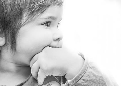 grayscale photo of girl doing thumb-suck thumbnail