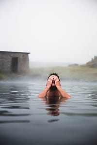 Man In Volcanic Pool Photo thumbnail