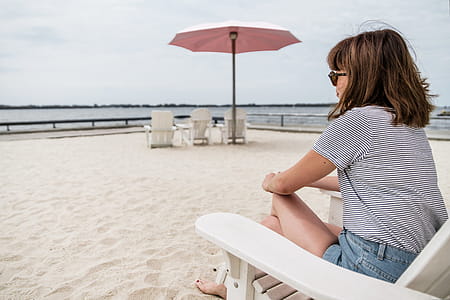 Woman sitting on beach chair thumbnail