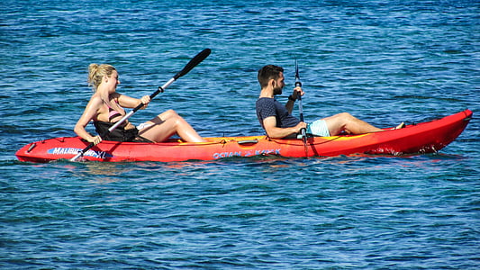 man and woman on kayak during daytime thumbnail