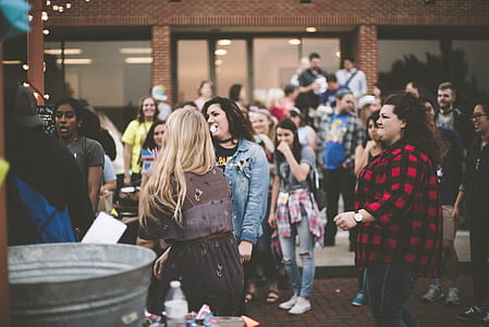 people in outdoor standing and talking at daytime thumbnail