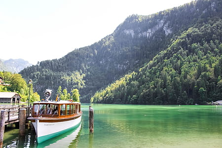 Parked Passenger Boat on Body of Water thumbnail