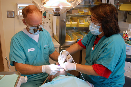 two person wears blue medical scrub shirt inside the hospital thumbnail