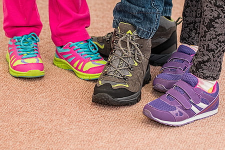 three person near each other wearing shoes thumbnail