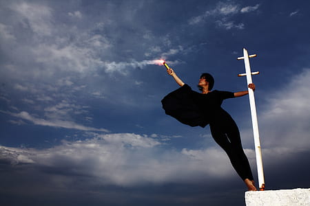 woman in black outfit holding in white steel bar thumbnail