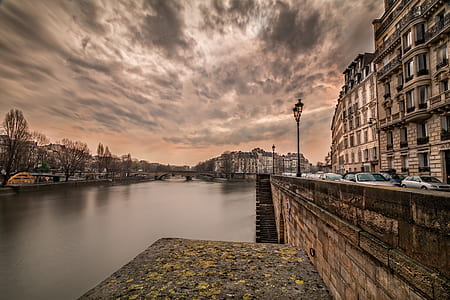 buildings near body of water during golden hour thumbnail