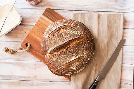 round pastry on brown wooden chopping board thumbnail