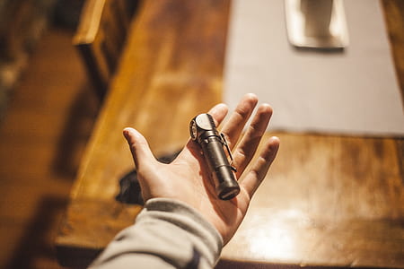 Person Left Hand Holding Stainless Steel Tool thumbnail
