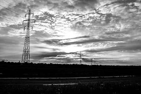 grayscale photography of trees and clouds thumbnail