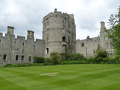 gray concrete castle surrounded by green lawn grass during daytime thumbnail