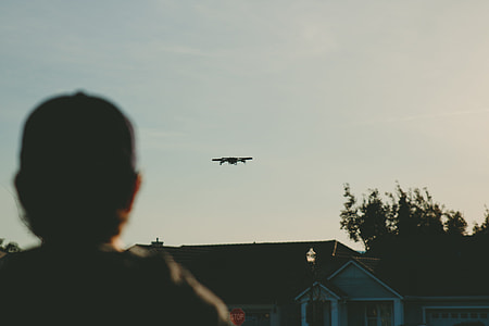 man standing in front of house thumbnail