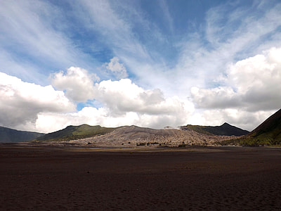 clouds over gray stony mountains during day thumbnail