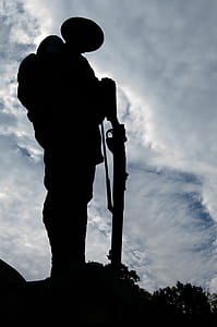 silhouette of soldier holding rifle thumbnail