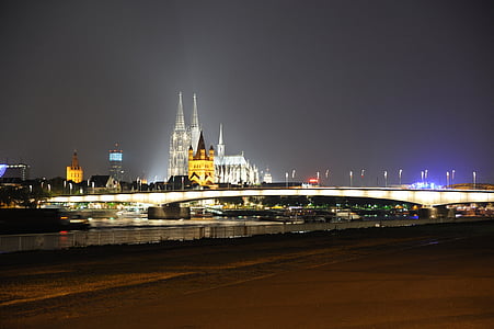 lighted cityscape bridge at night thumbnail