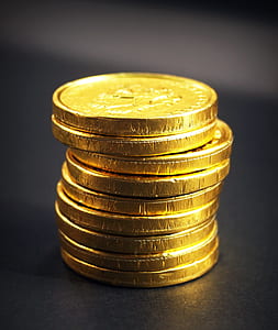 round gold-colored coins on black board thumbnail