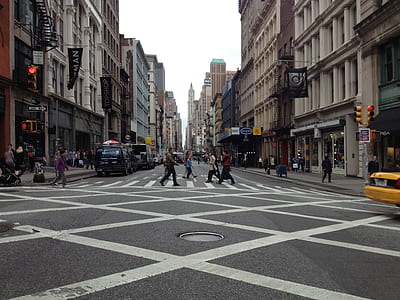 people crossing pedestrian crossing at day thumbnail