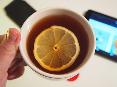 slice lemon in ceramic cup filled with tea thumbnail