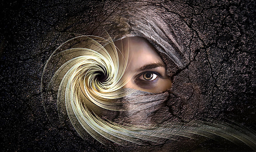 Face in stone with spiral eye thumbnail