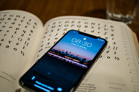 silver iPhone X on opened book thumbnail