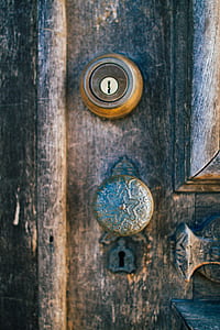 brown door key hole and knob in brown wooden door thumbnail