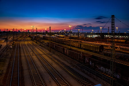 Aerial Photo of Train Rails Under Golden Sky thumbnail