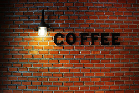coffee signage on brown concrete wall blocks thumbnail