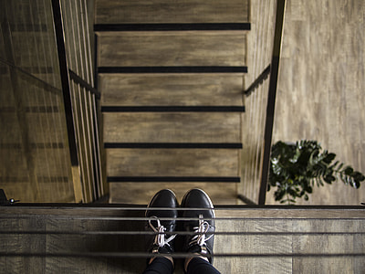 person wearing black leather shoes thumbnail
