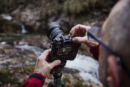 person holding camera thumbnail