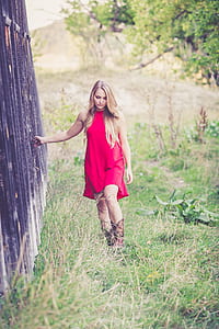 woman wearing red sleeveless dress thumbnail