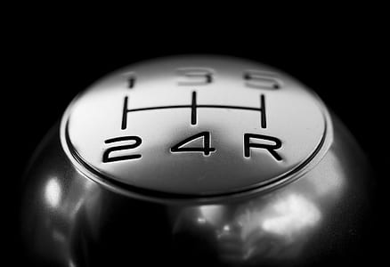closeup photo of 5 gear vehicle gear shift knob thumbnail