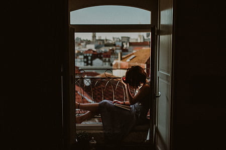 woman sitting on opened window thumbnail