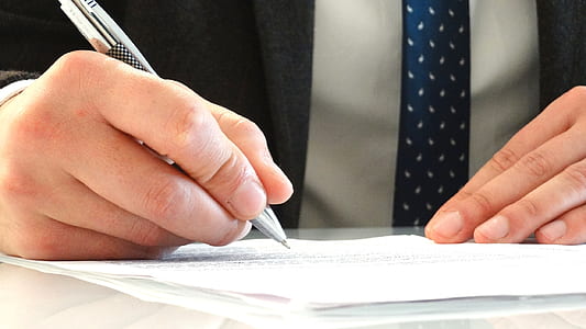 person holding grey pen thumbnail