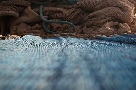 closeup photo of blue knit cloth thumbnail