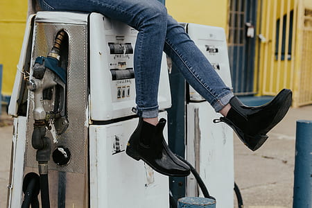 woman white sitting on fuel pump tank thumbnail