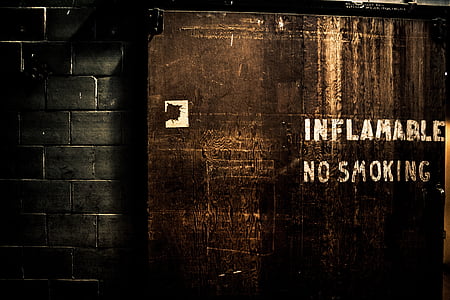 brown wooden board with inflamable no smoking text thumbnail