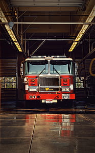 red firetruck parked on building thumbnail
