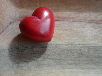 red heart on wooden surface thumbnail